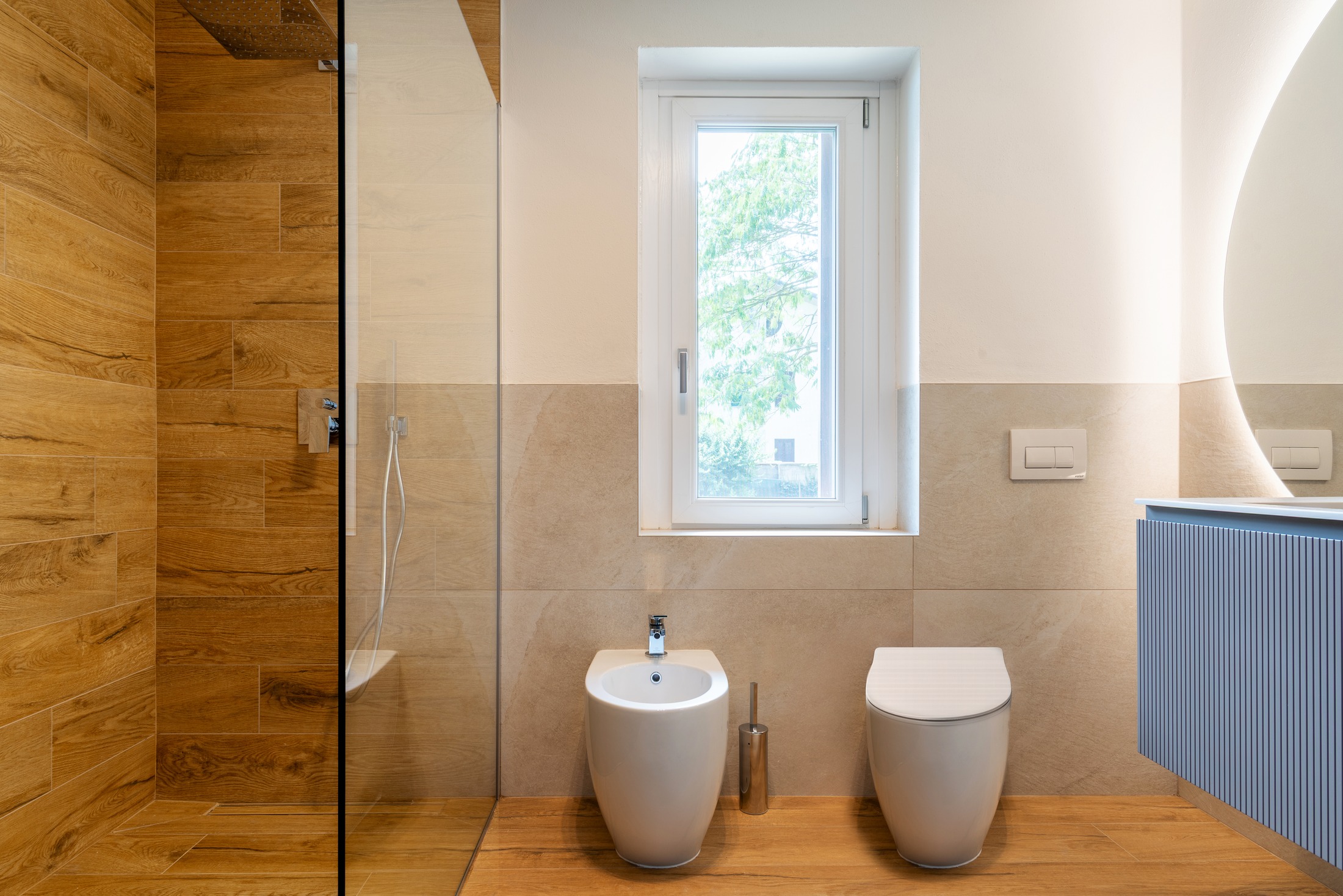 The new bath — wood-grain wet room, window to the garden