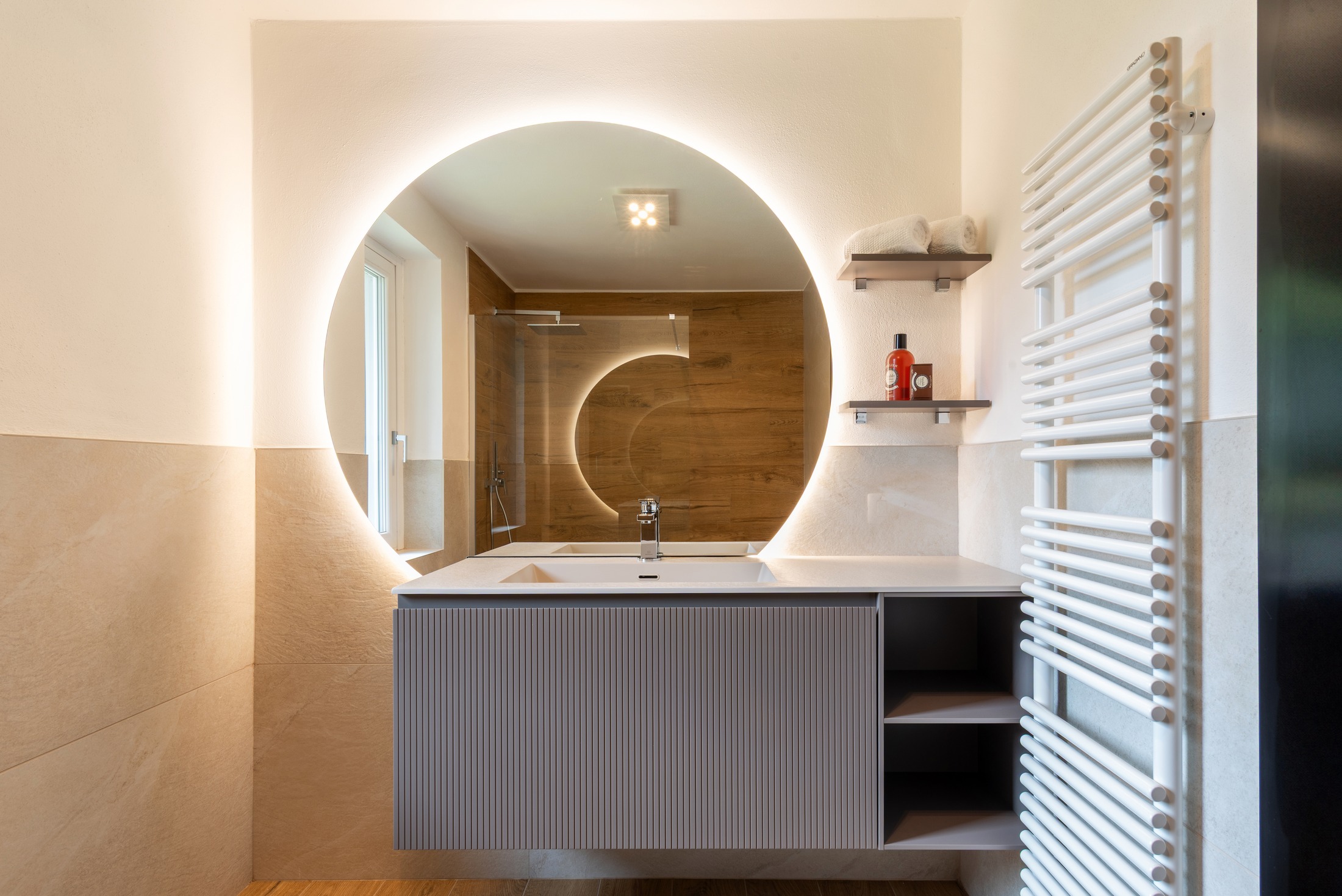 Round backlit mirror — fluted vanity, the new bath
